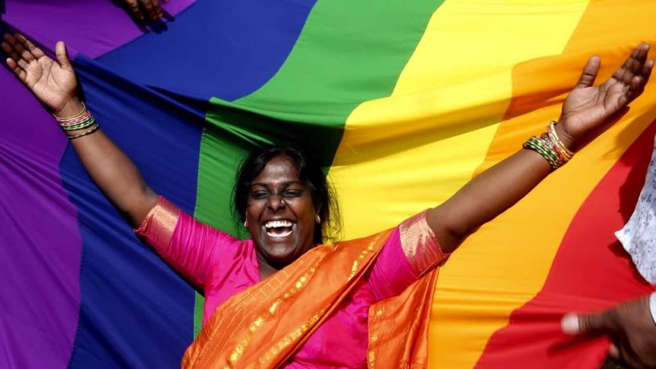 Indian activists of the lesbian, gay, bisexual, and transgender (LGBT) community celebrate after hearing the Supreme Court verdict.