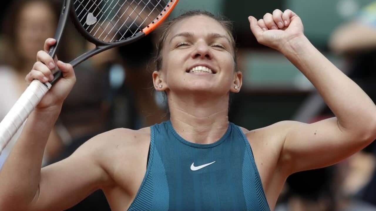 Romania's Simona Halep celebrates a win over Belgium's Elise Mertens.