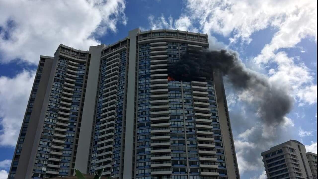 Smoke billows from a high-rise apartment building in Honolulu