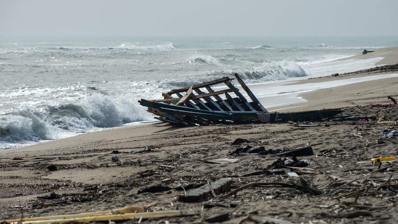 Wreckage of the boat on the beach at Crotone (AAP).jpg