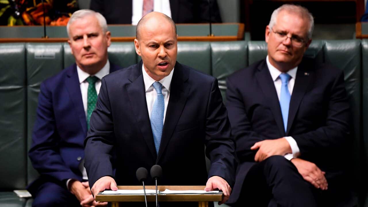 Australian Treasurer Josh Frydenberg hands down his third Federal Budget in the House of Representatives at Parliament House in Canberra, 11 May, 2021.