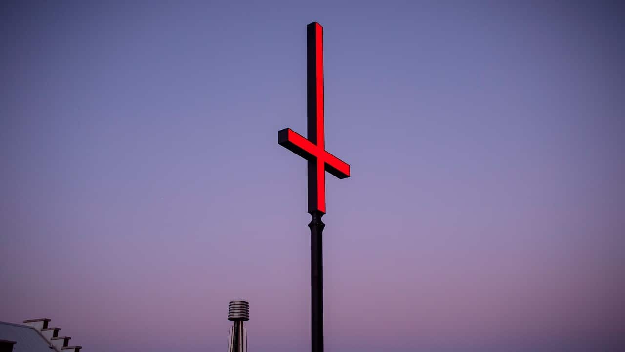 A giant red inverted crosses installed at the Hobart waterfront as part of the annual Dark Mofo festival.