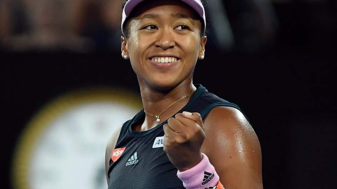 Naomi Osaka of Japan celebrates.
