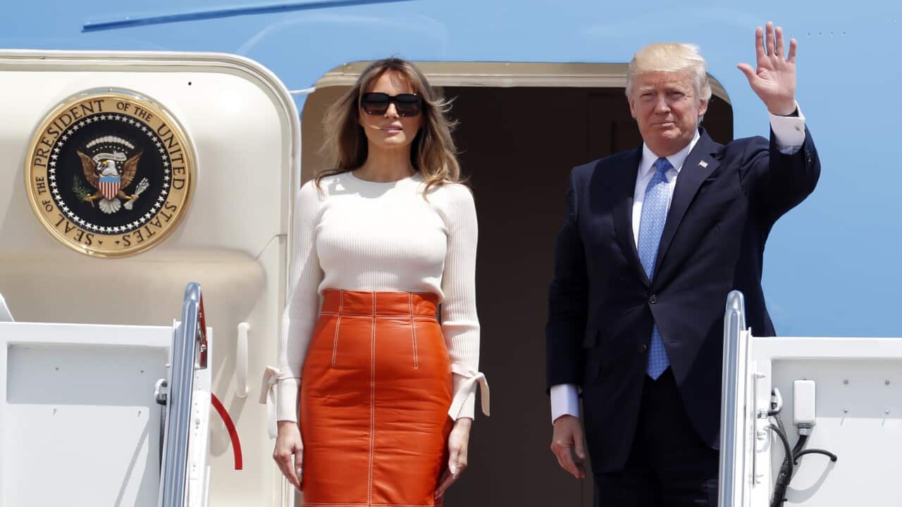 President Donald Trump with first lady Melania Trump as they board Air Force One at Andrews Air Force Base.