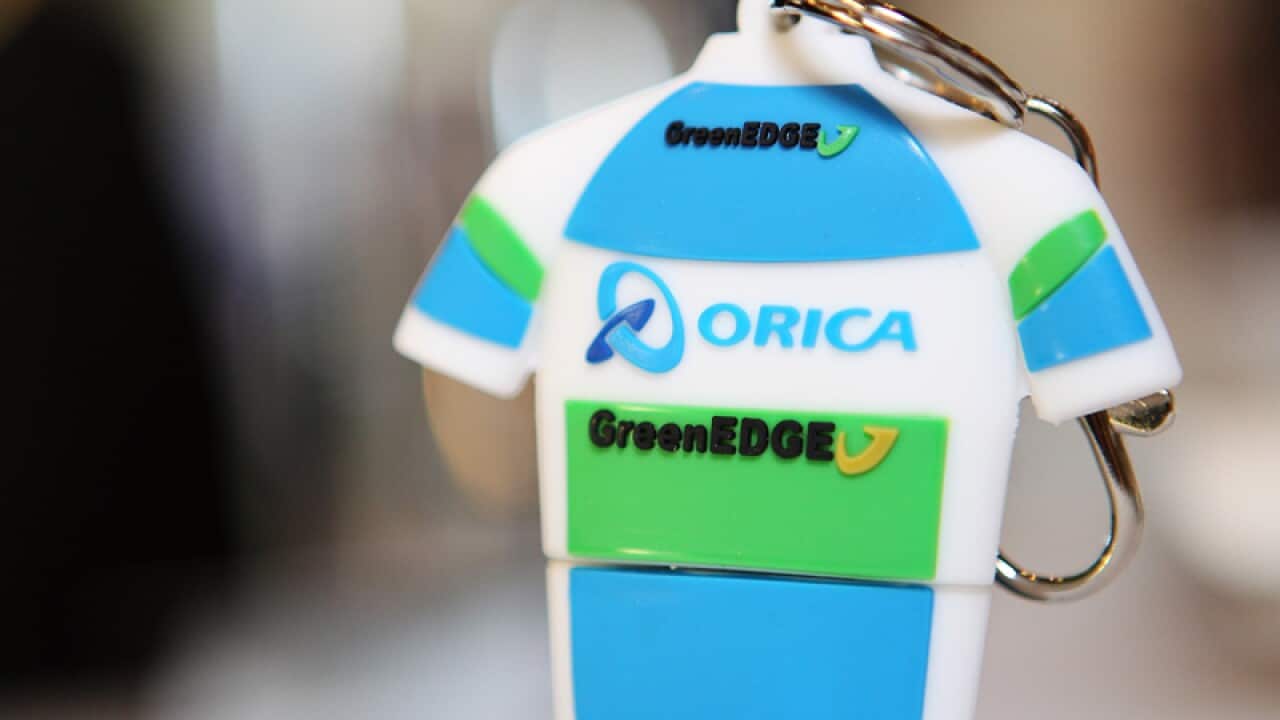 An Orica GreenEDGE keyring in the shape of a cyclist's jersey