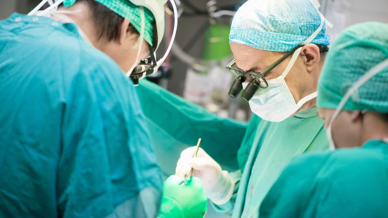 Surgeons carrying out a heart operation