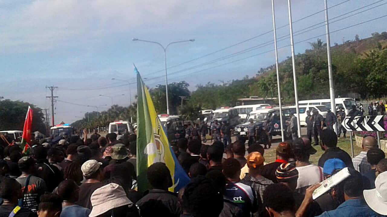 Students protest outside the University of PNG's Port Moresby campus