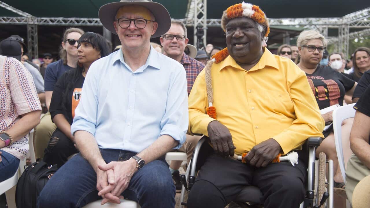 Yunupingu sits next to Prime Minister Anthony Albanese at the 2022 Garma Festival.