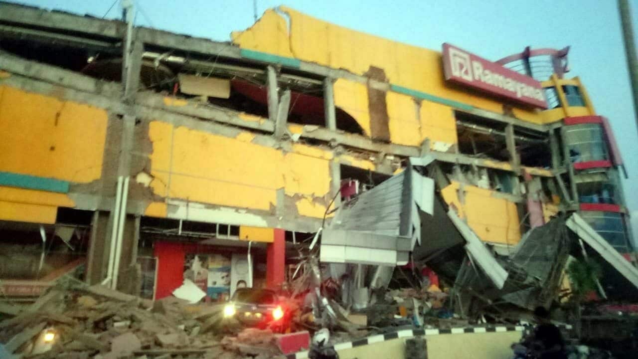 A collapsed shopping mall after a 7.7 magnitude earthquake that hit in Donggala, Central Sulawesi, Indonesia.