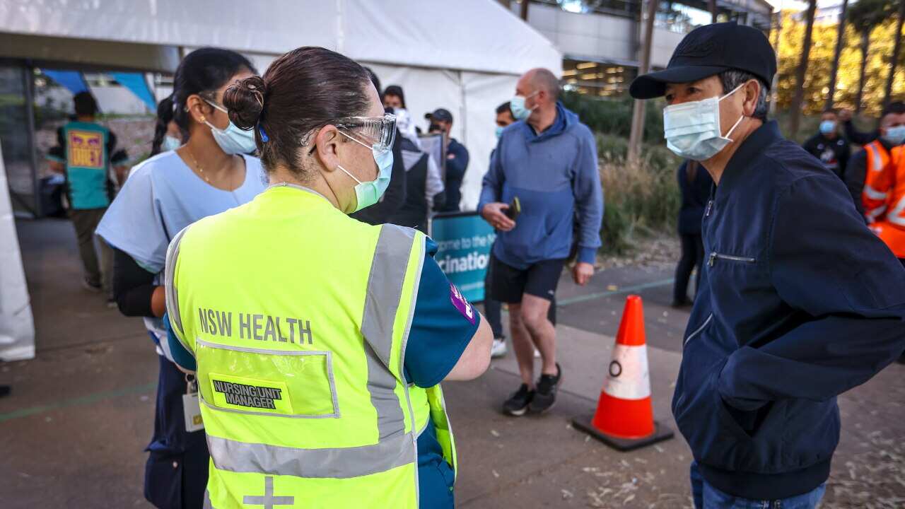 People at the Sydney Olympic Park Vaccination Centre at Homebush in Sydney, Sunday, August 15, 2021.