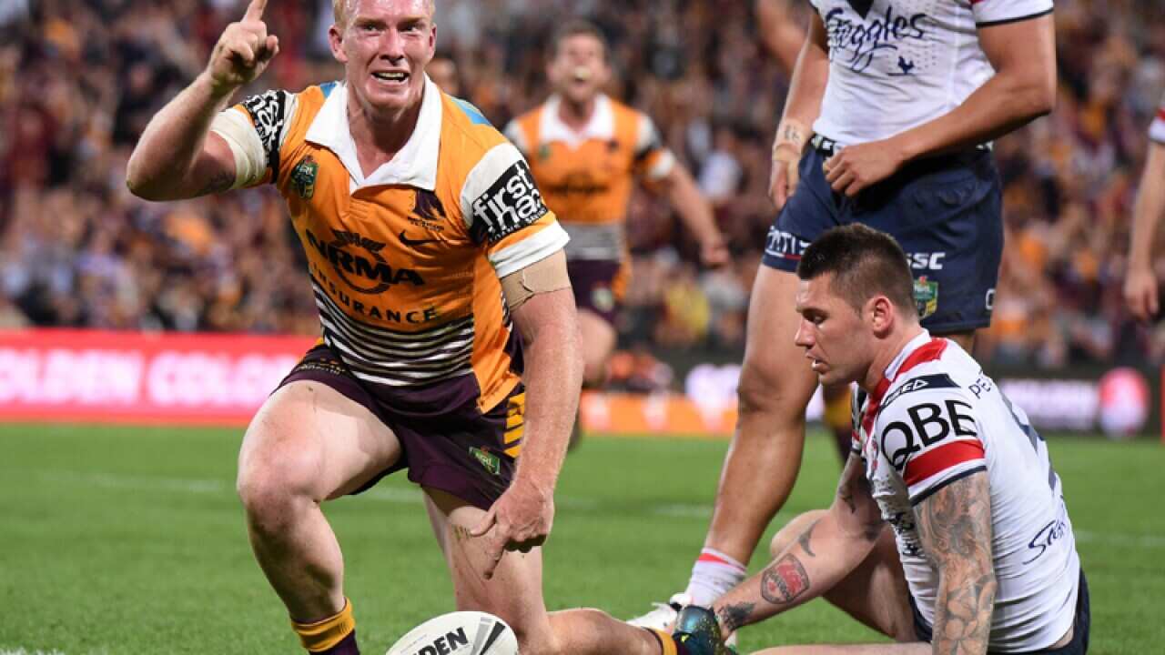 Jack Reed of the Brisbane Broncos (left) celebrates.