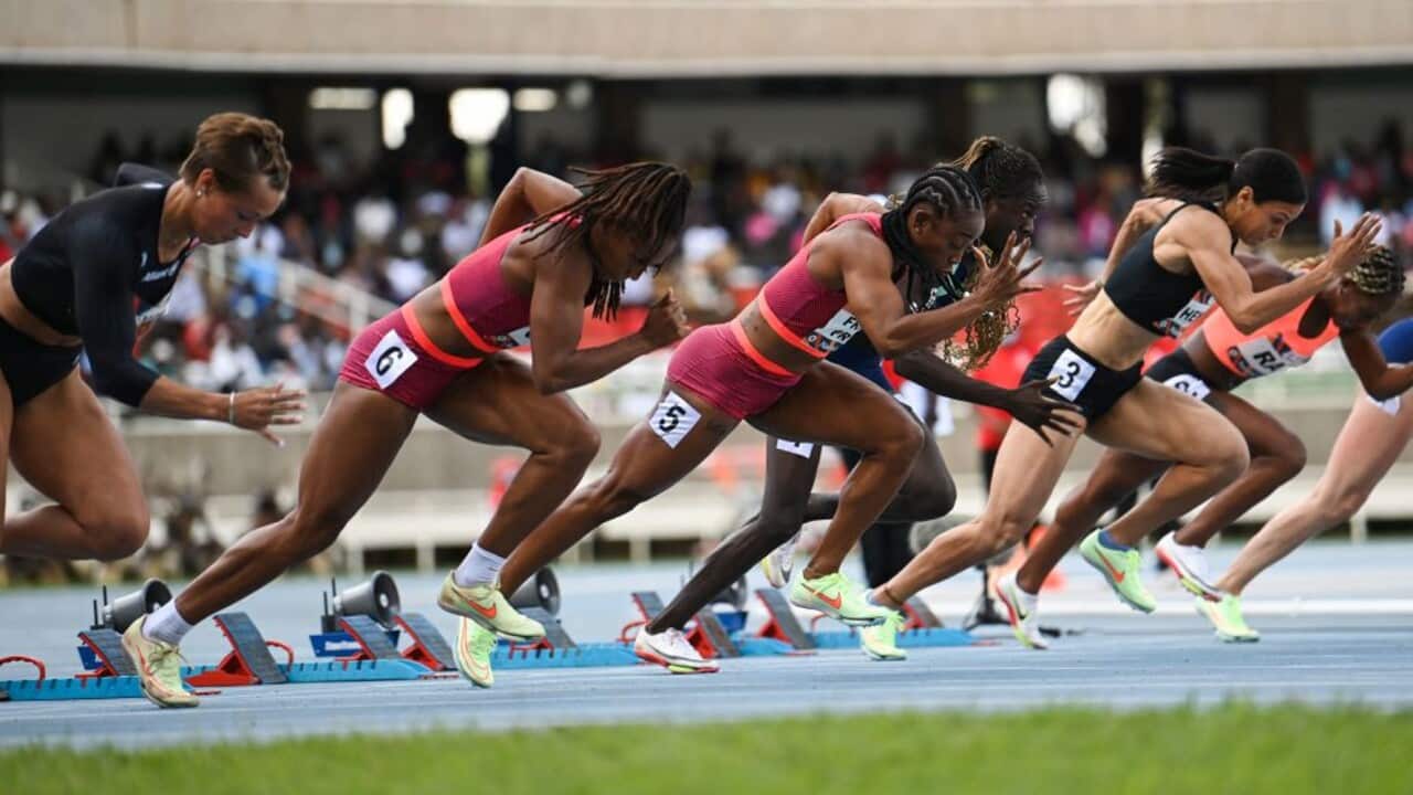 Jamaica's Shelly-Ann Fraser Pryce (C) competes in the women's 100m event