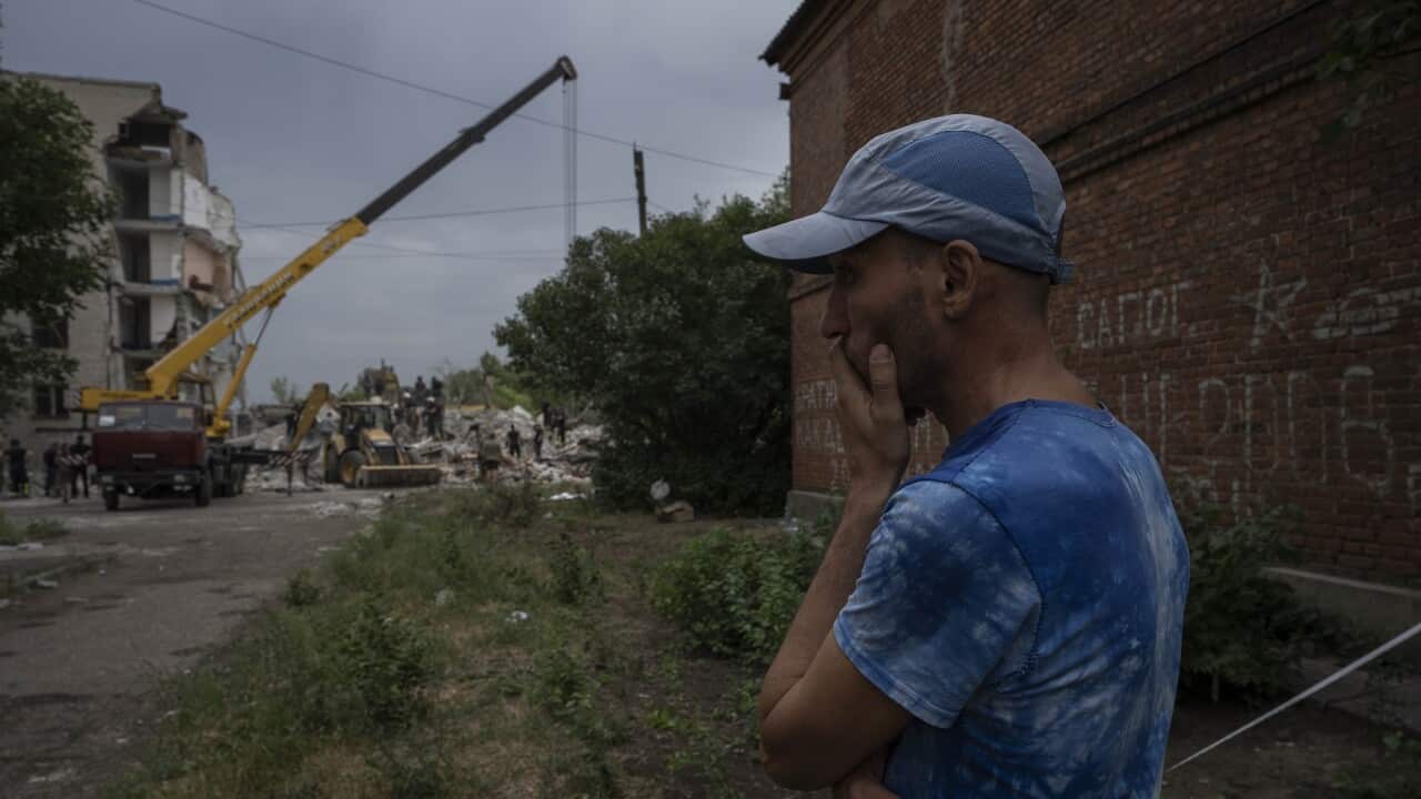 Valerii waits to hear news about his nephew and sister, who he believes still under the rubble