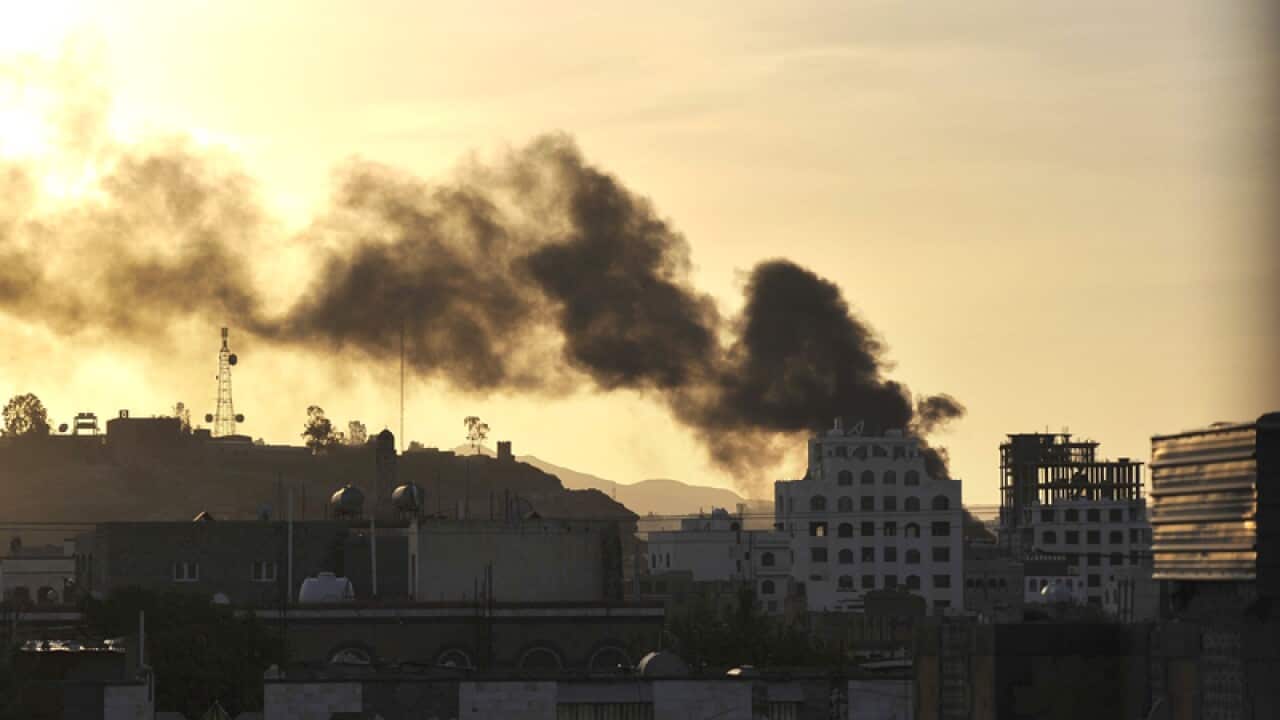 Smokes rise from a neighbourhood near the Yemeni state TV headquarters