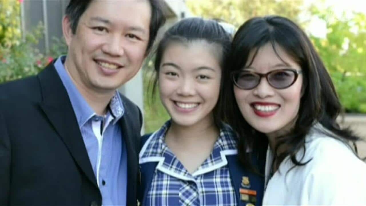 Melbourne Presbyterian Ladies College student Natalie Liu (centre), pictured with her parents, got a perfect score in the International Baccalaureate. (SBS News)