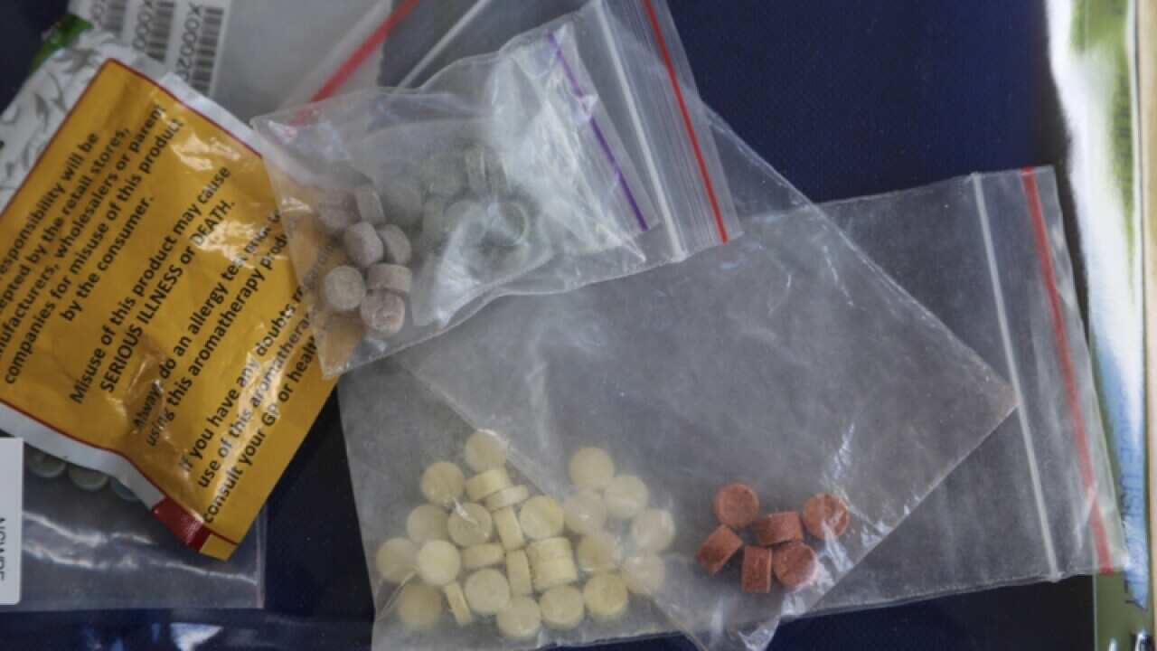 Items seized by NSW police after early morning raids in Sydney
