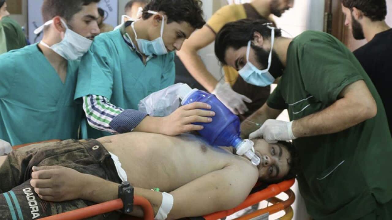 Medical staff treat a man after an alleged chemical attack in Idlib