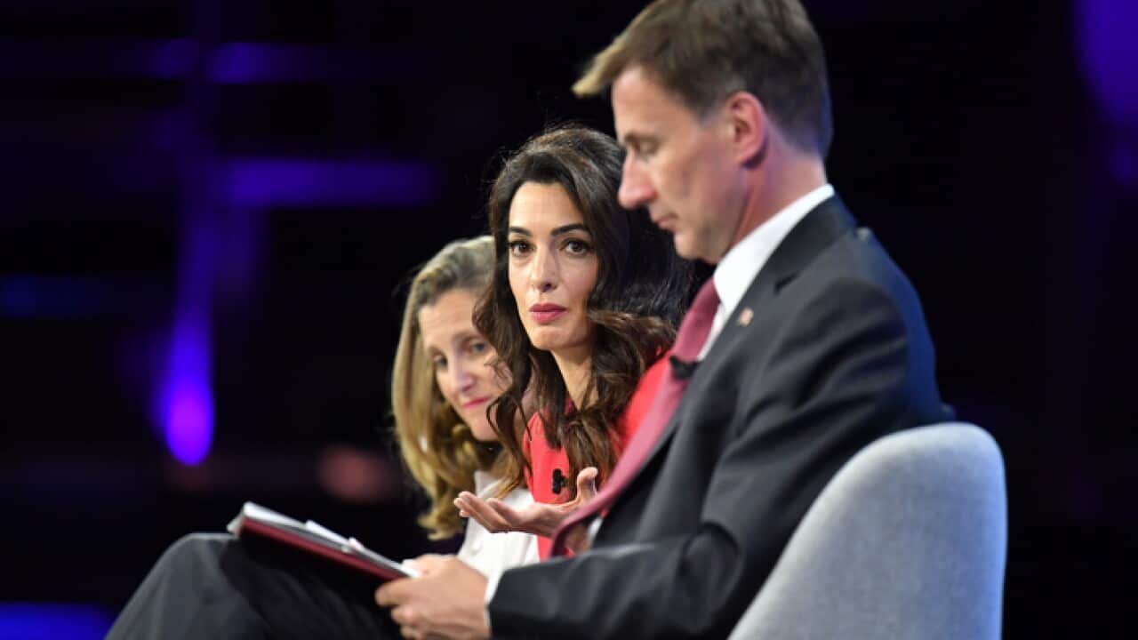 Amal Clooney and Jeremy Hunt during the Global Conference for Media Freedom in London