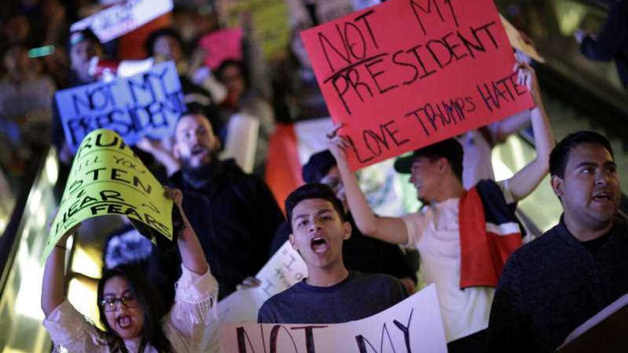Protesters demonstrate in opposition to the election of President-elect, Donald Trump, as they march along the Las Vegas Strip, Saturday, Nov. 12, 2016