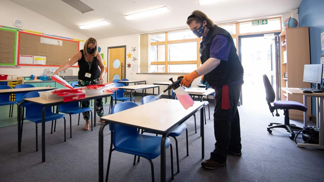 Desks are disinfected at a primary school in Britain ahead of pupils' return