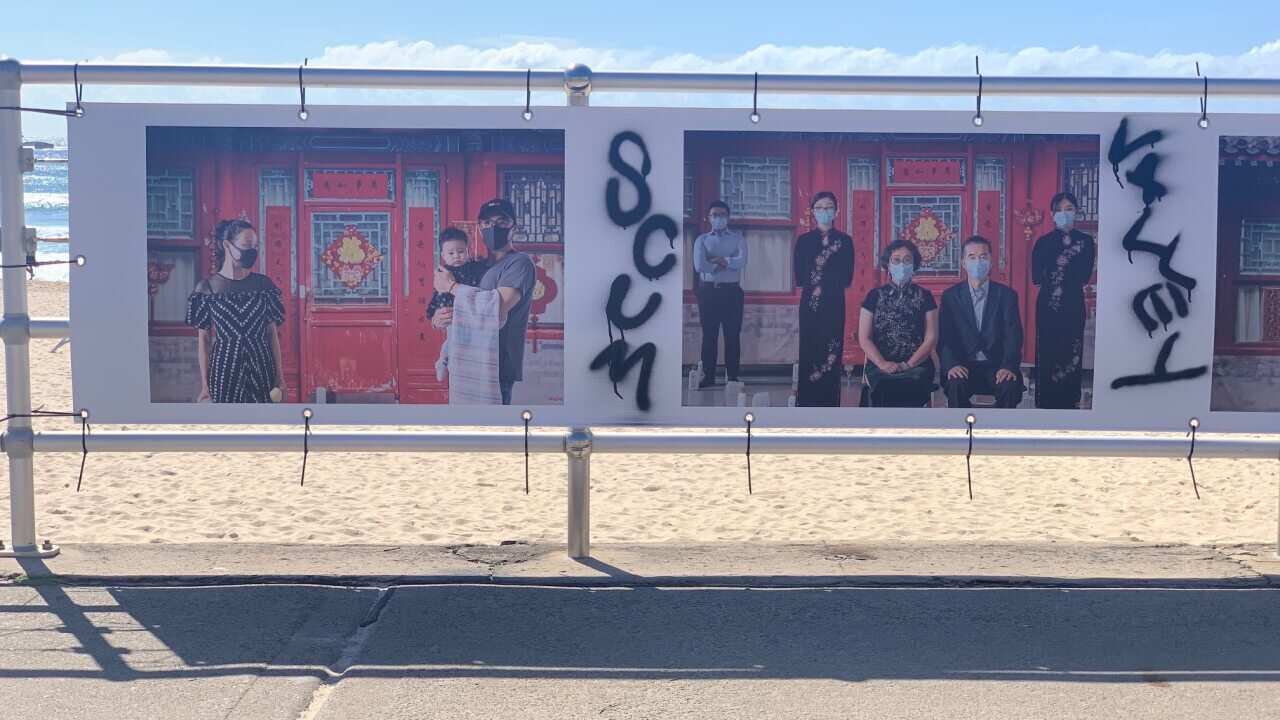 Vandalised artwork on Bondi Beach.