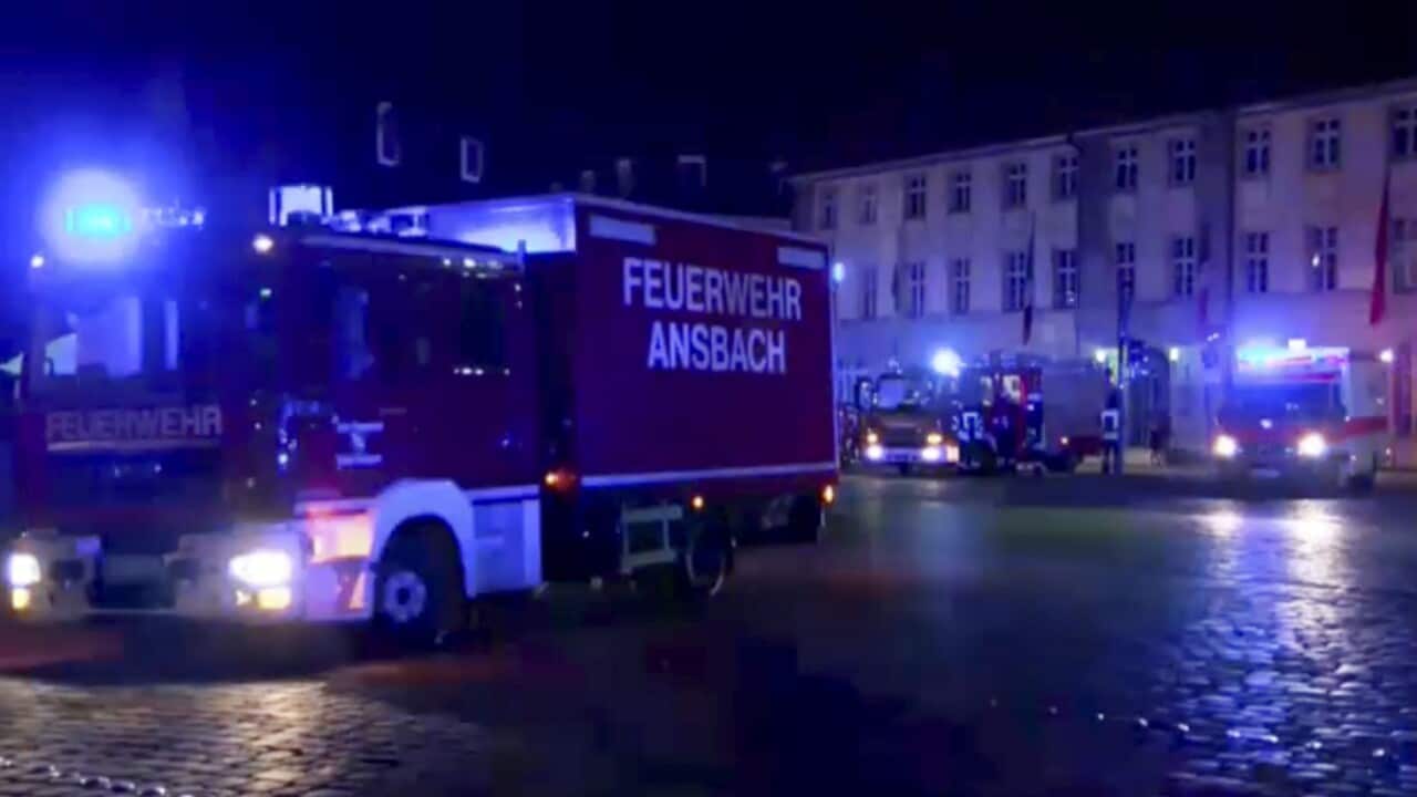 Fire trucks and ambulances stand in the city center of Ansbach near Nuremberg, southern Germany, following an explosion at a restaurant.
