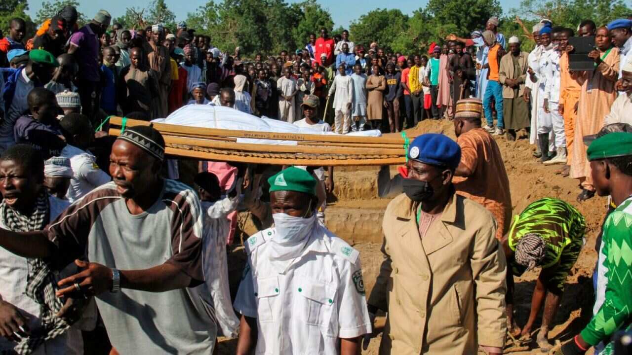 Mourners attend the funeral of 43 farm workers in Zabarmari, about 20km from Maiduguri, Nigeria, after they were killed by Boko Haram fighters