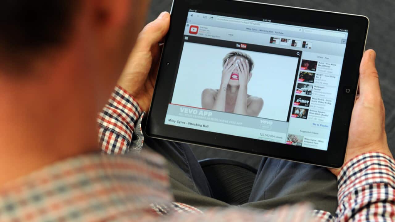 A YouTube user watches a music video on an iPad