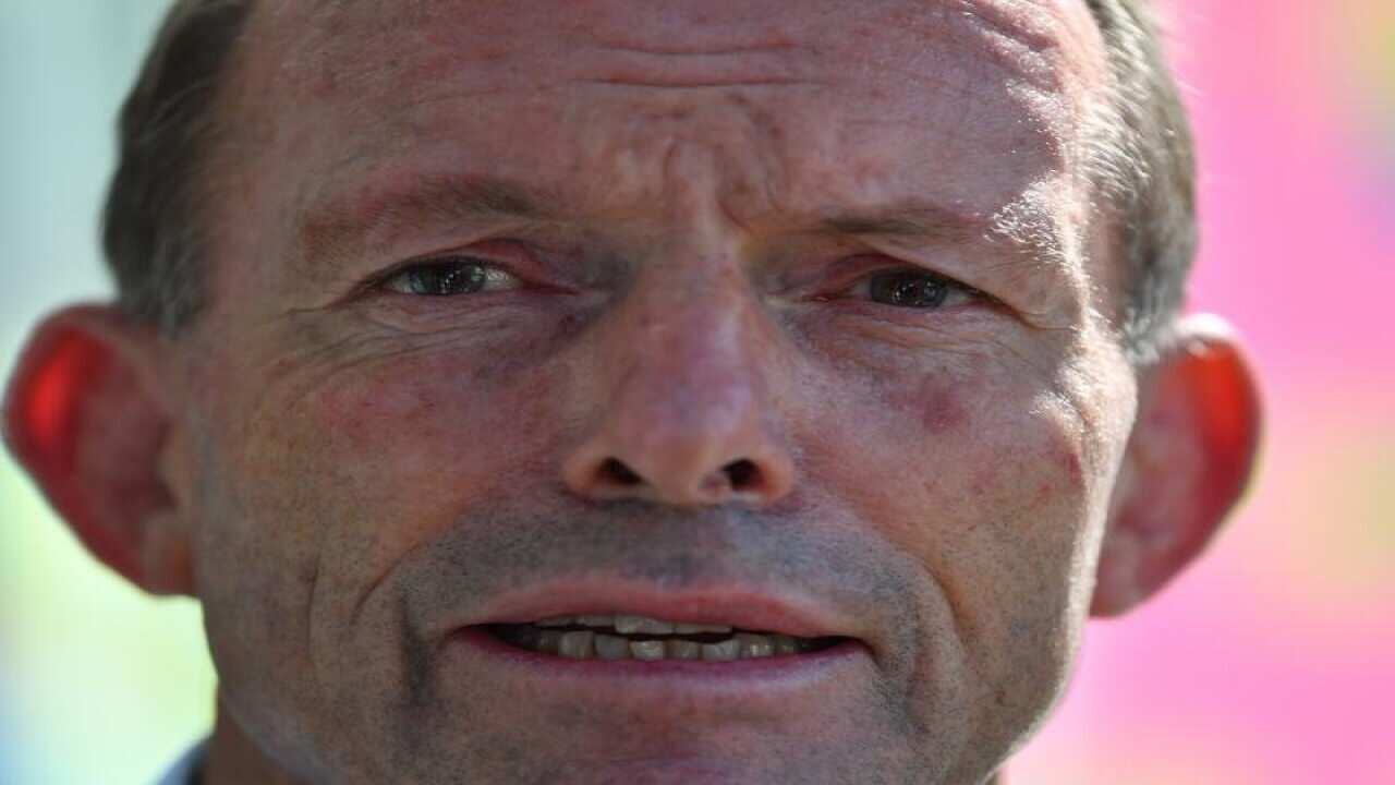 Offensive posters depicting Tony Abbott are being taken down.