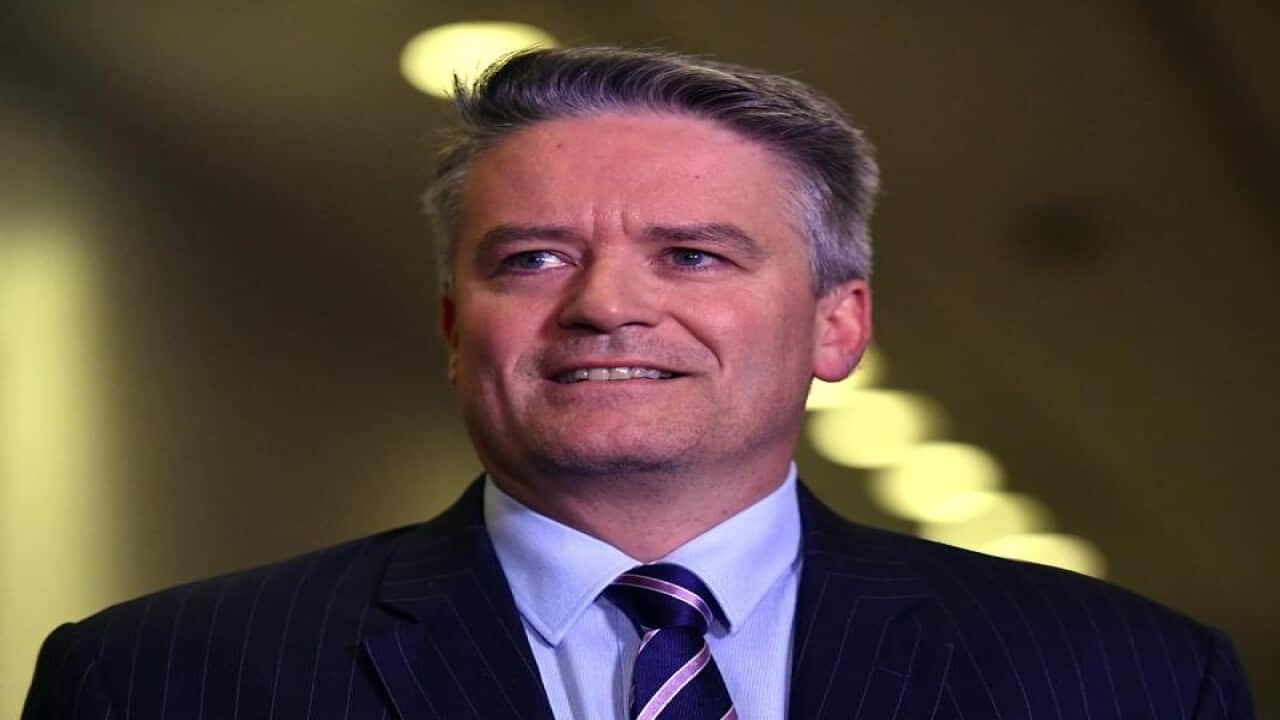 Senator Mathias Cormann smiles.