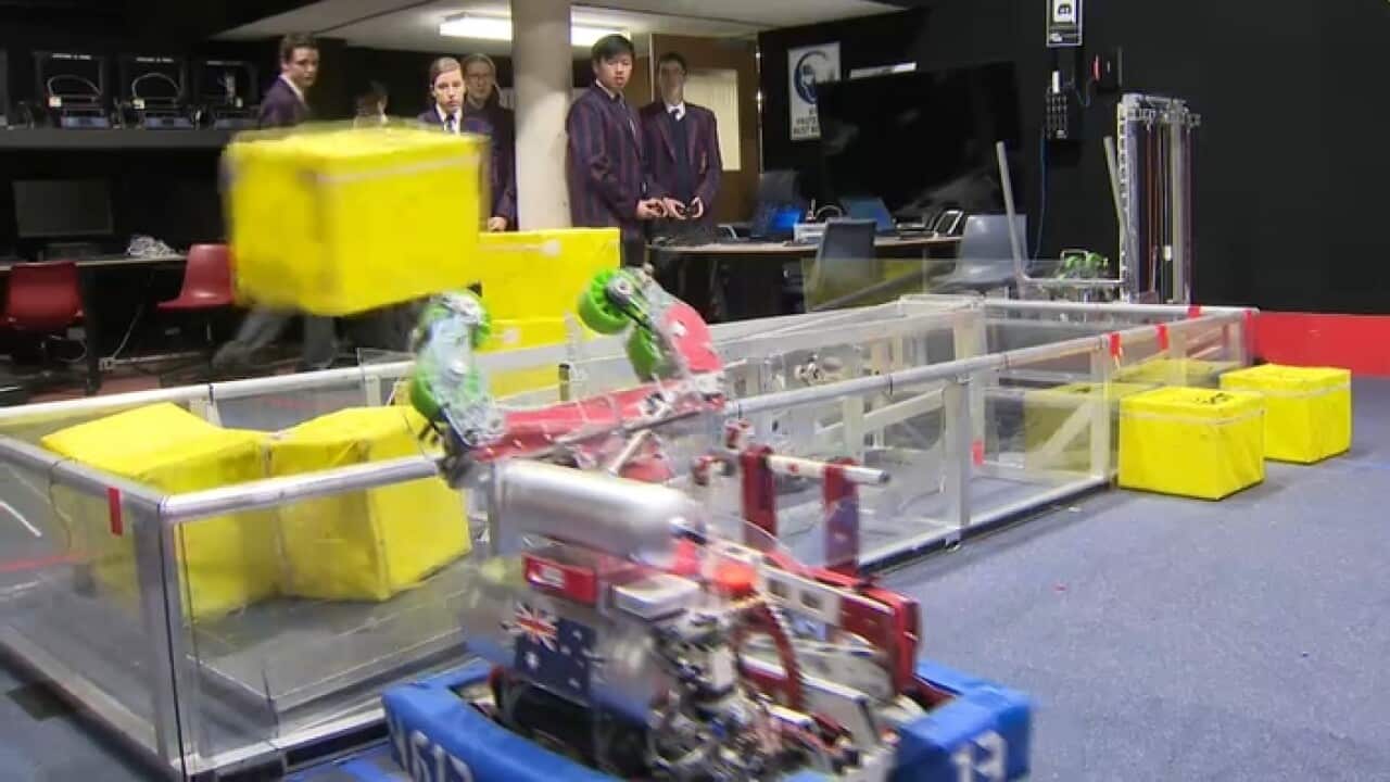 Barker College students with their robot at work