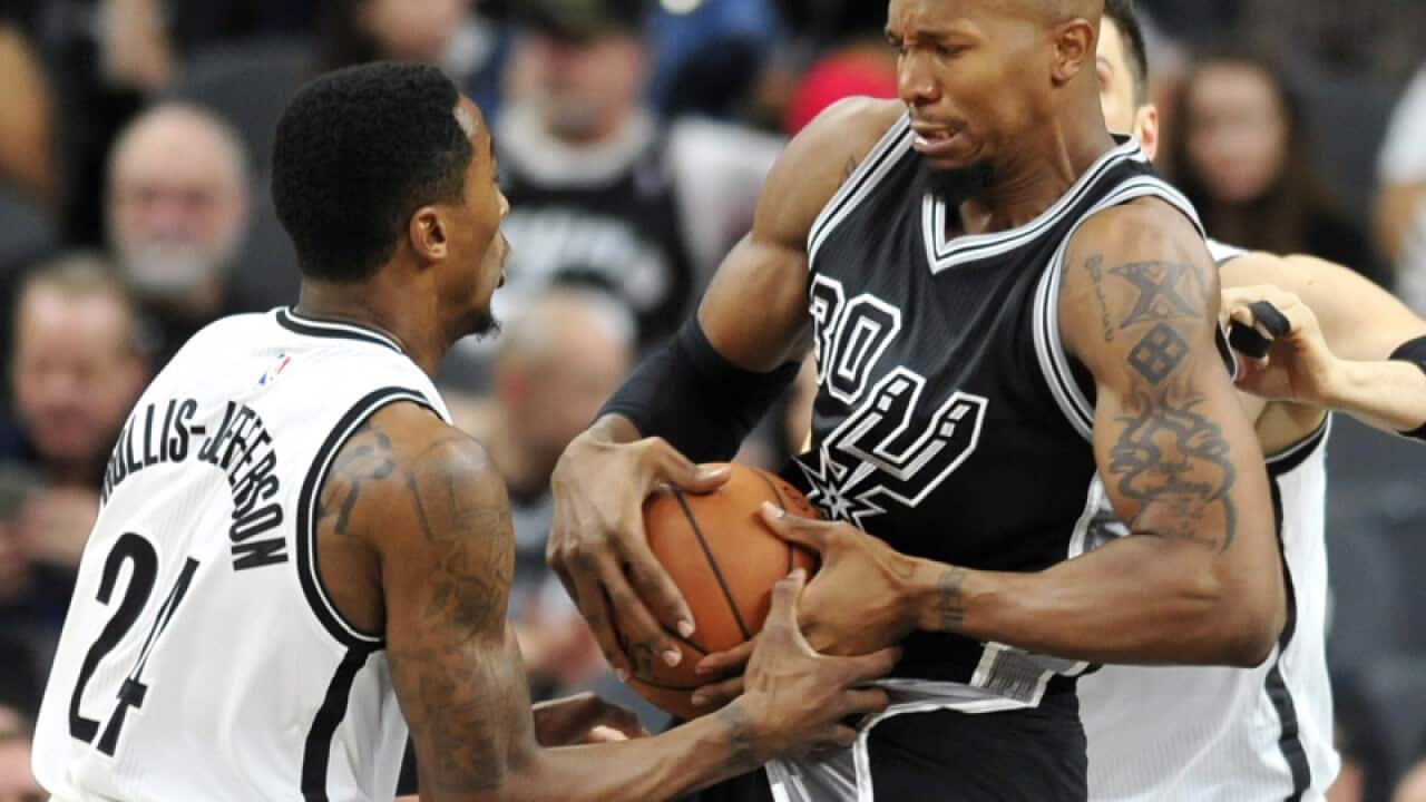 Rondae Hollis-Jefferson (L) and San Antonio David West