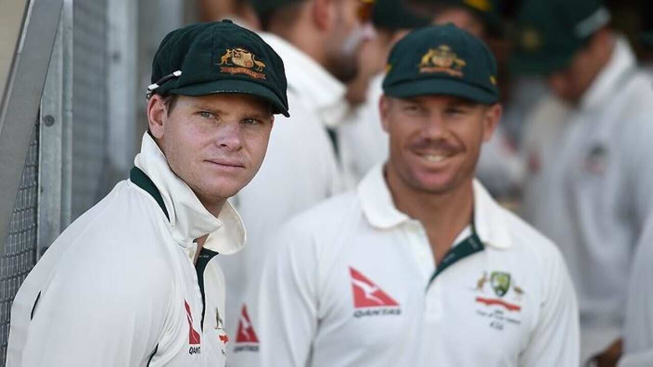 Australian captain Steve Smith, left, and Dave Warner stand down after the ball tampering incident n South Africa. (AAP)