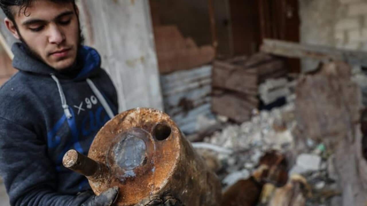 The US suspects Syria may have carried out a second chlorine gas attack in rebel-held Ghouta area.