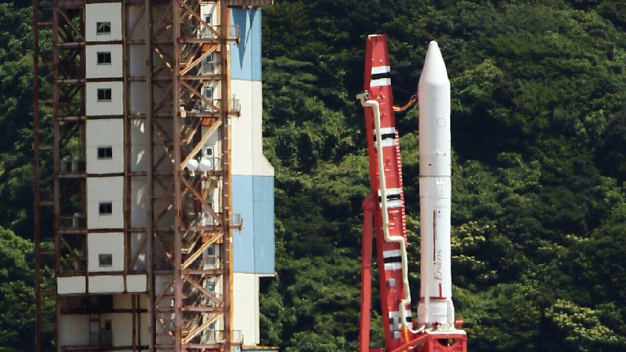 Japan's next-generation solid fuel rocket stands on a launching pad
