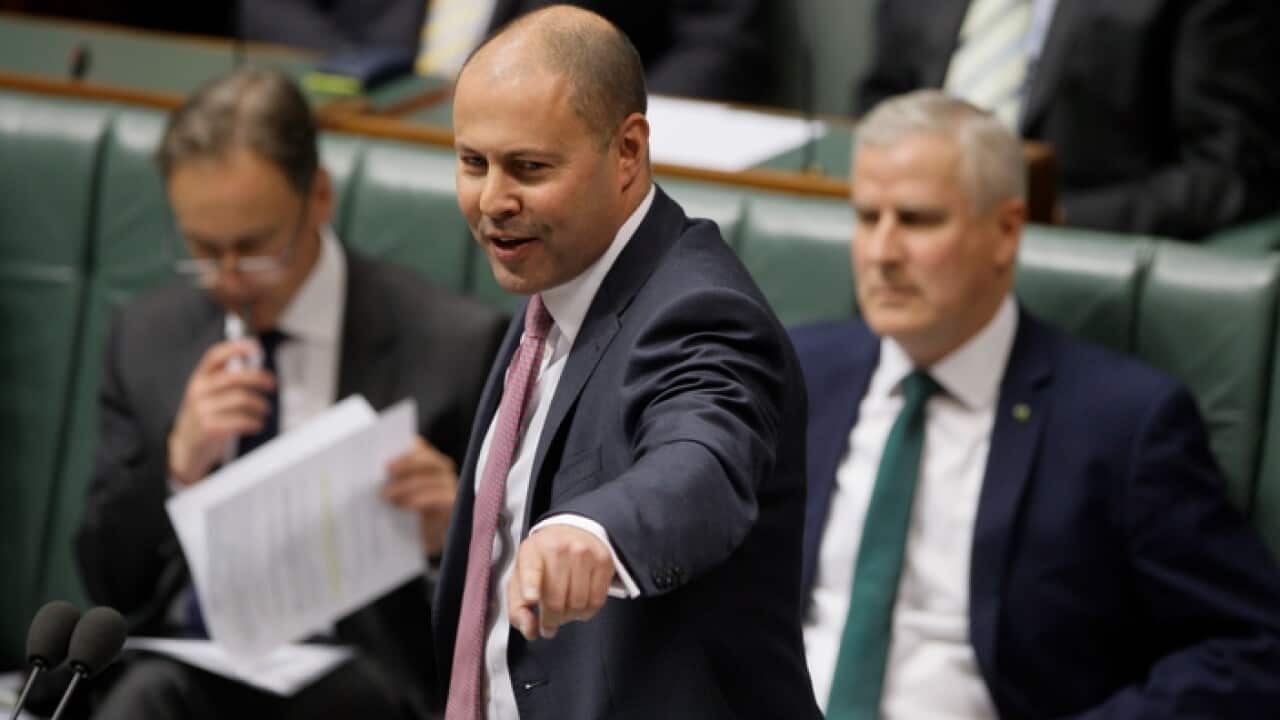 A happy federal Treasurer Josh Frydenberg