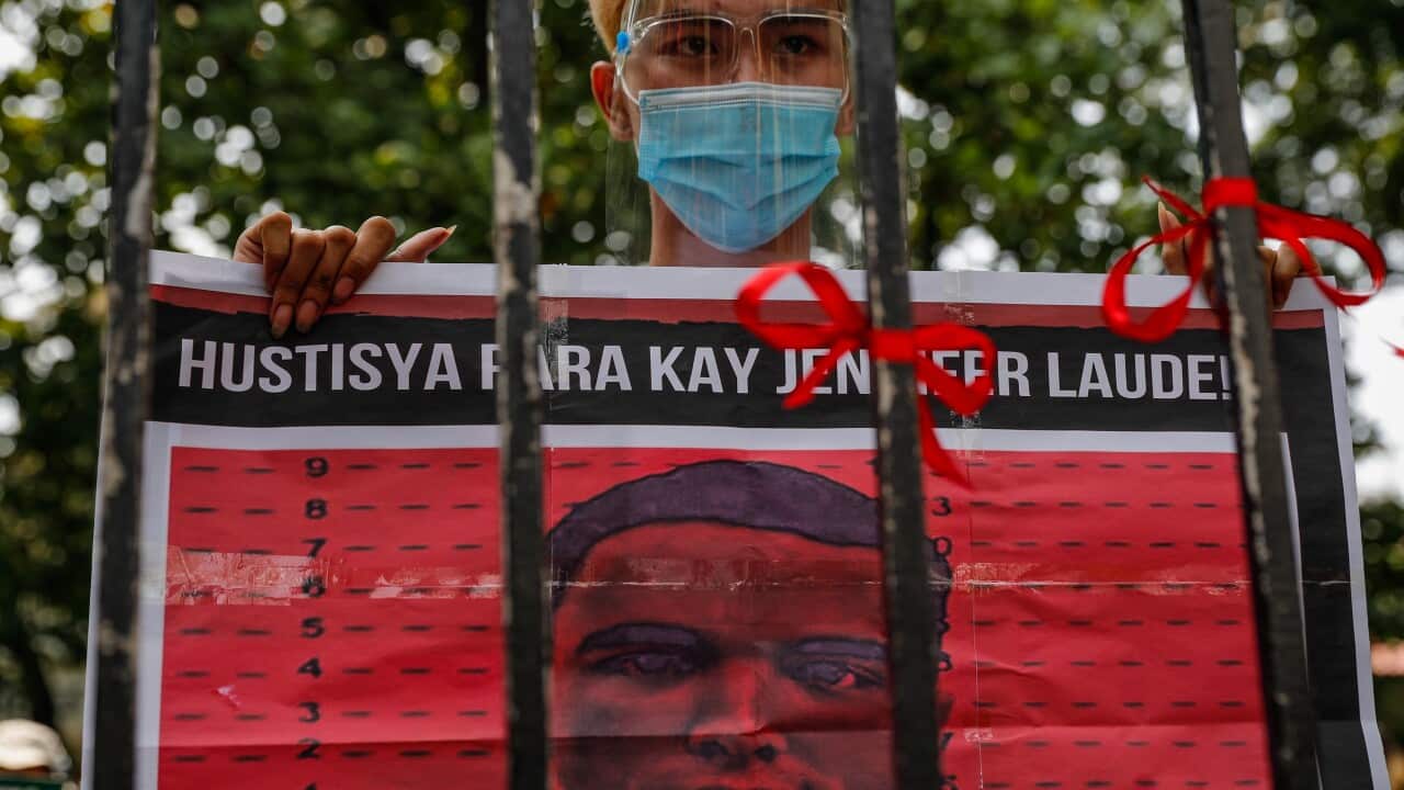 An activist holds a placard during a protest at the Department of Justice in Manila, Philippines, 03 September 2020.