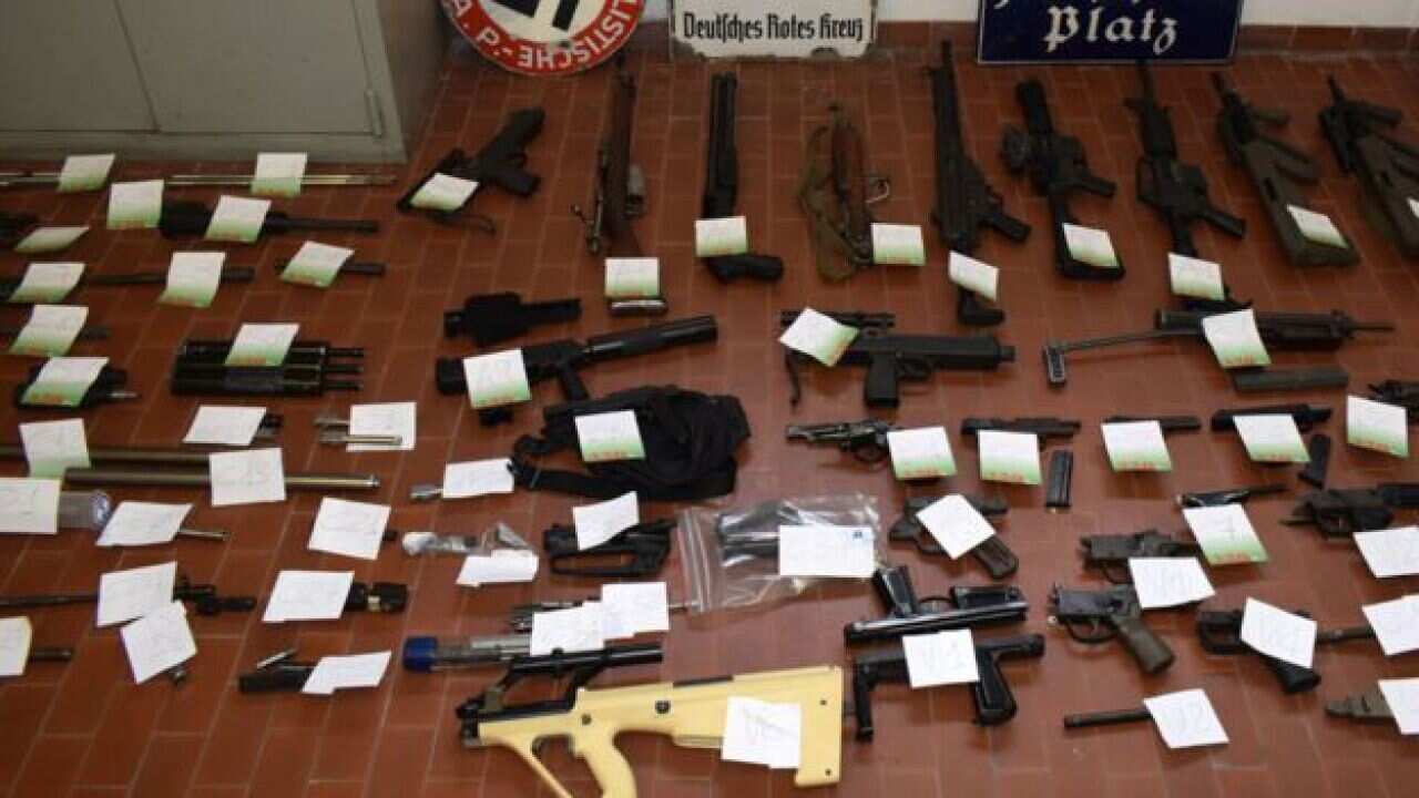 Police also captured a cache of weapons, including automatic weapons.