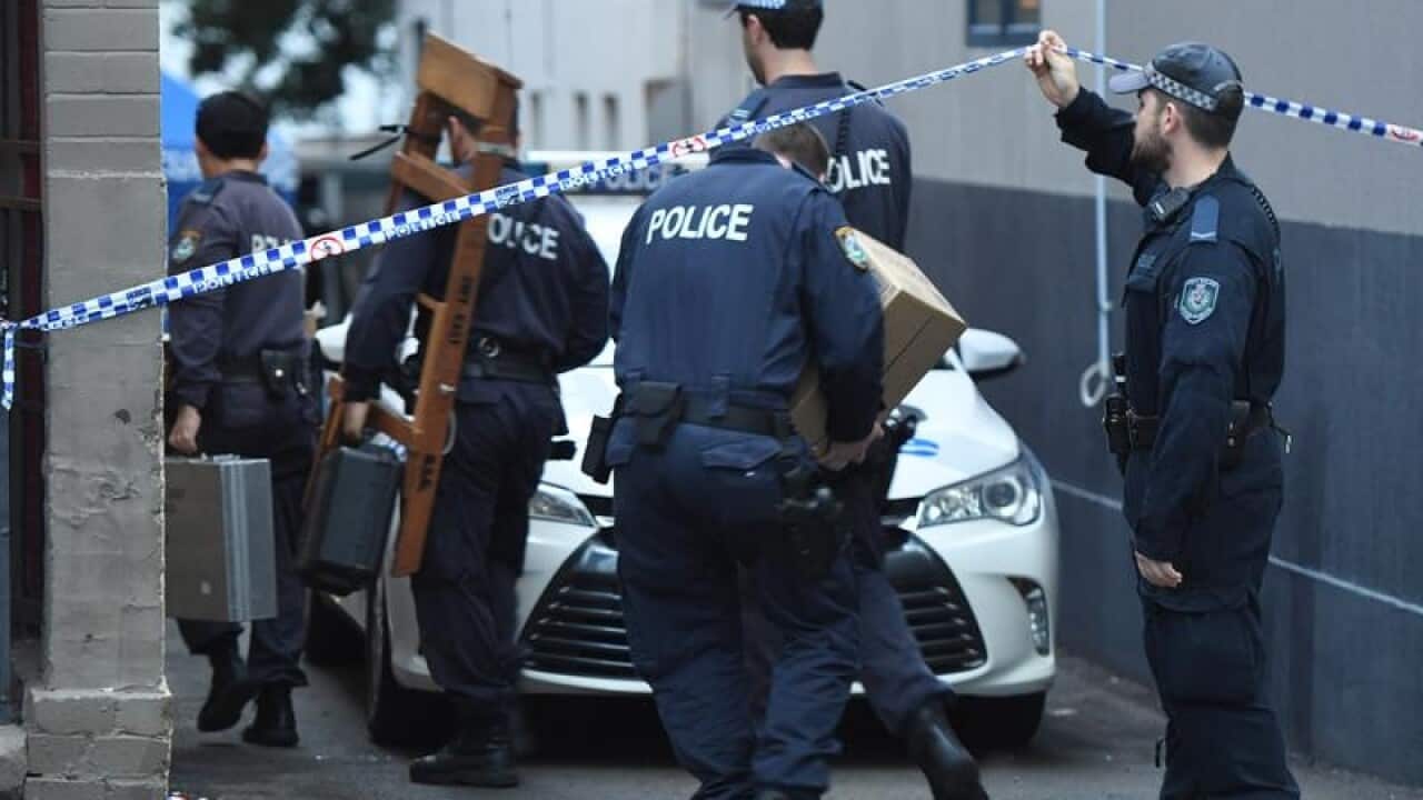 Police during the raids (AAP)