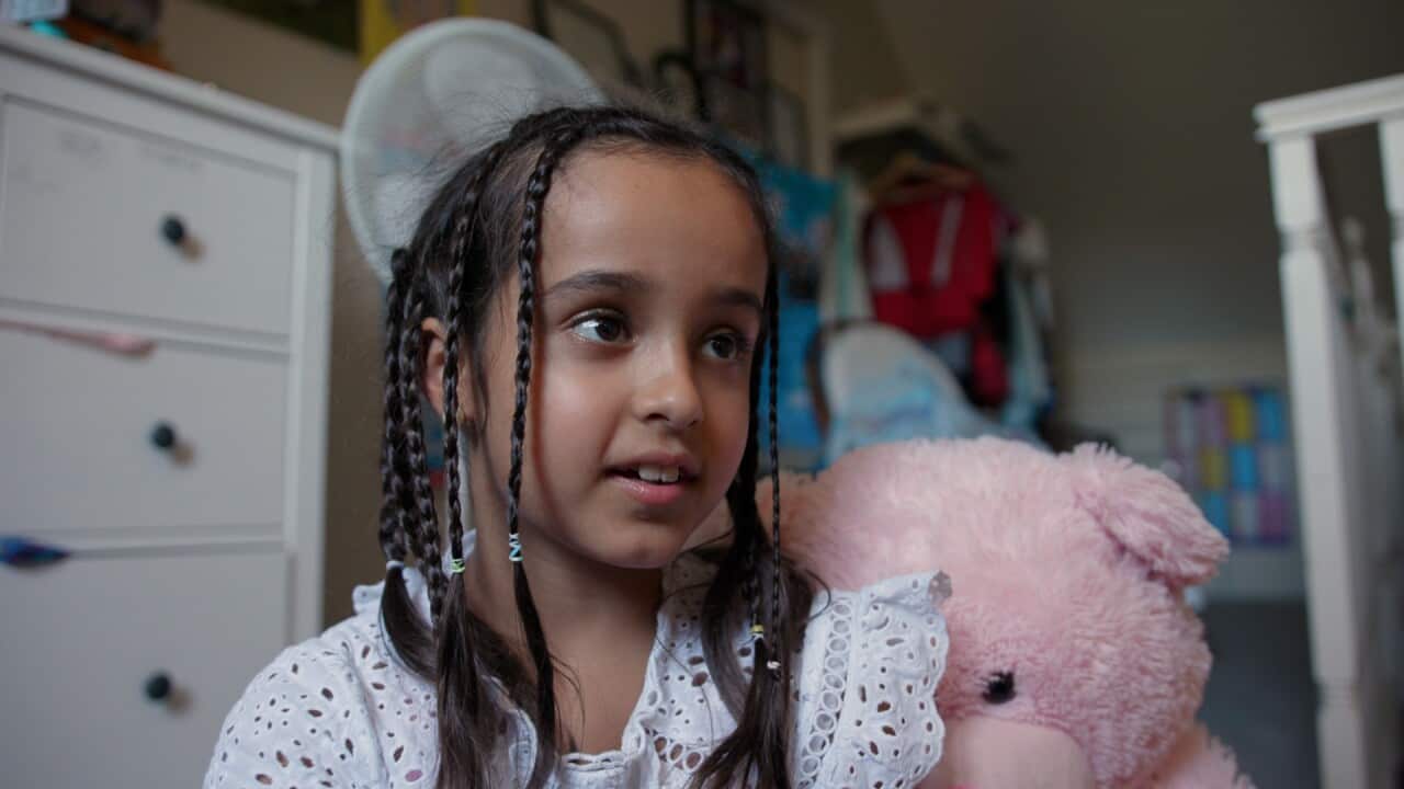 Liora talks to the camera.