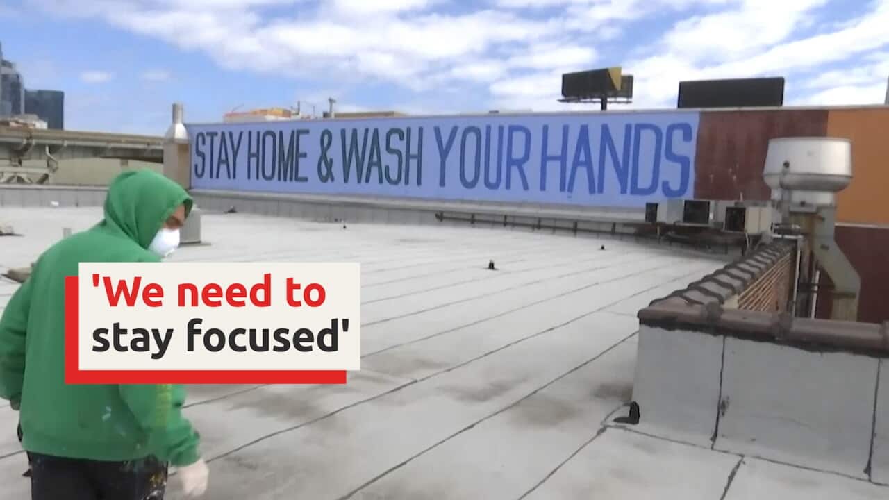 Street artist takes to NYC walls to fight virus