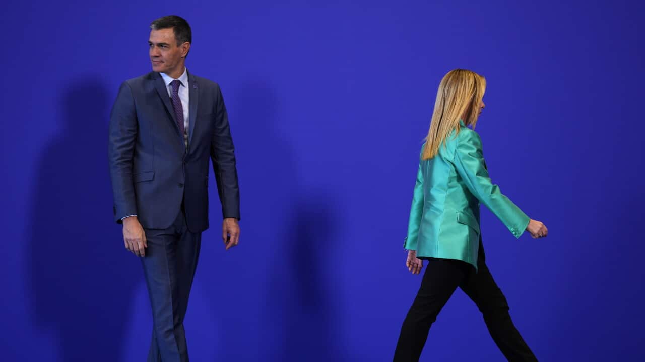 Italy's Prime Minister Giorgia Meloni walks after meeting Spain's acting Prime Minister Pedro Sanchez on arrival for the second day of the Europe Summit in Granada, Spain, Friday, Oct. 6, 2023.