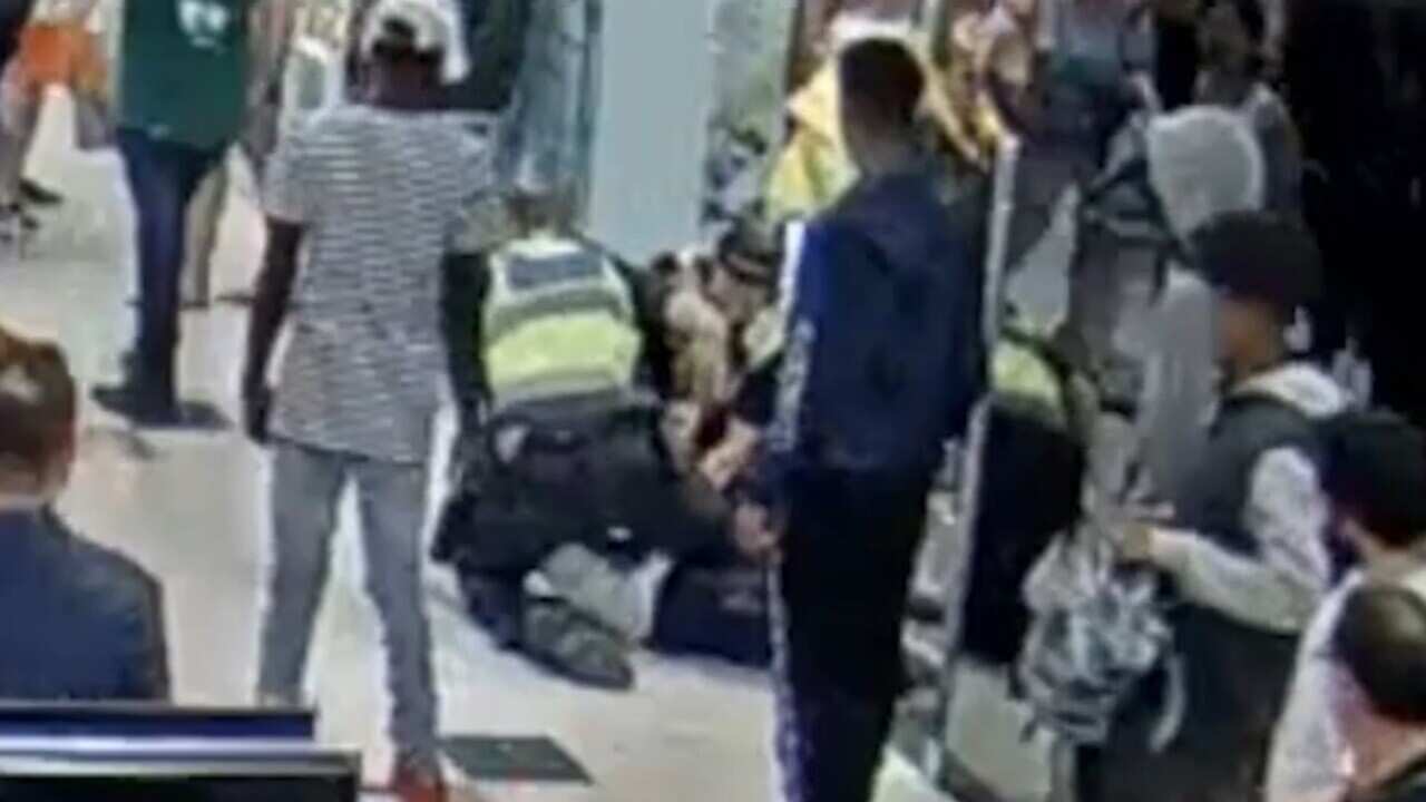 The CCTV footage showing the policeman attempting to hold a youth down before the attack 