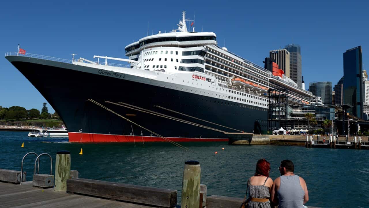 The Queen Mary 2 cruise ship is seen berthed at Circular Quay