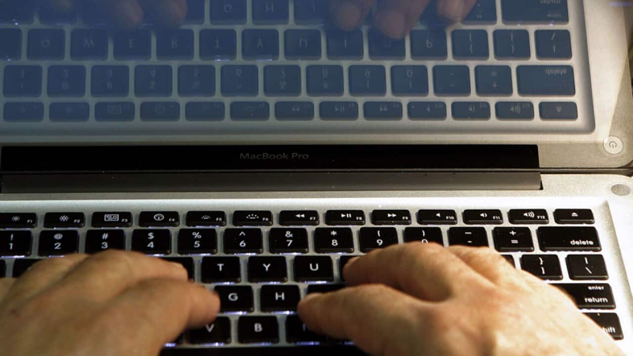 A person uses a laptop computer