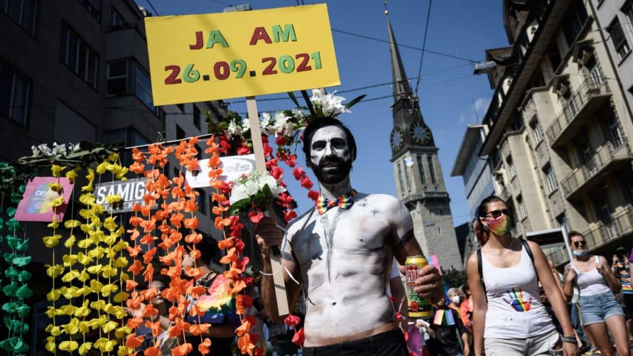 Members of lesbian, gay, bisexual, transgender, intersex and queer (LGBTIQ+) community take part in the Zurich Pride on September 4, 2021 ahead of a nationwide same-sex marriage vote.
