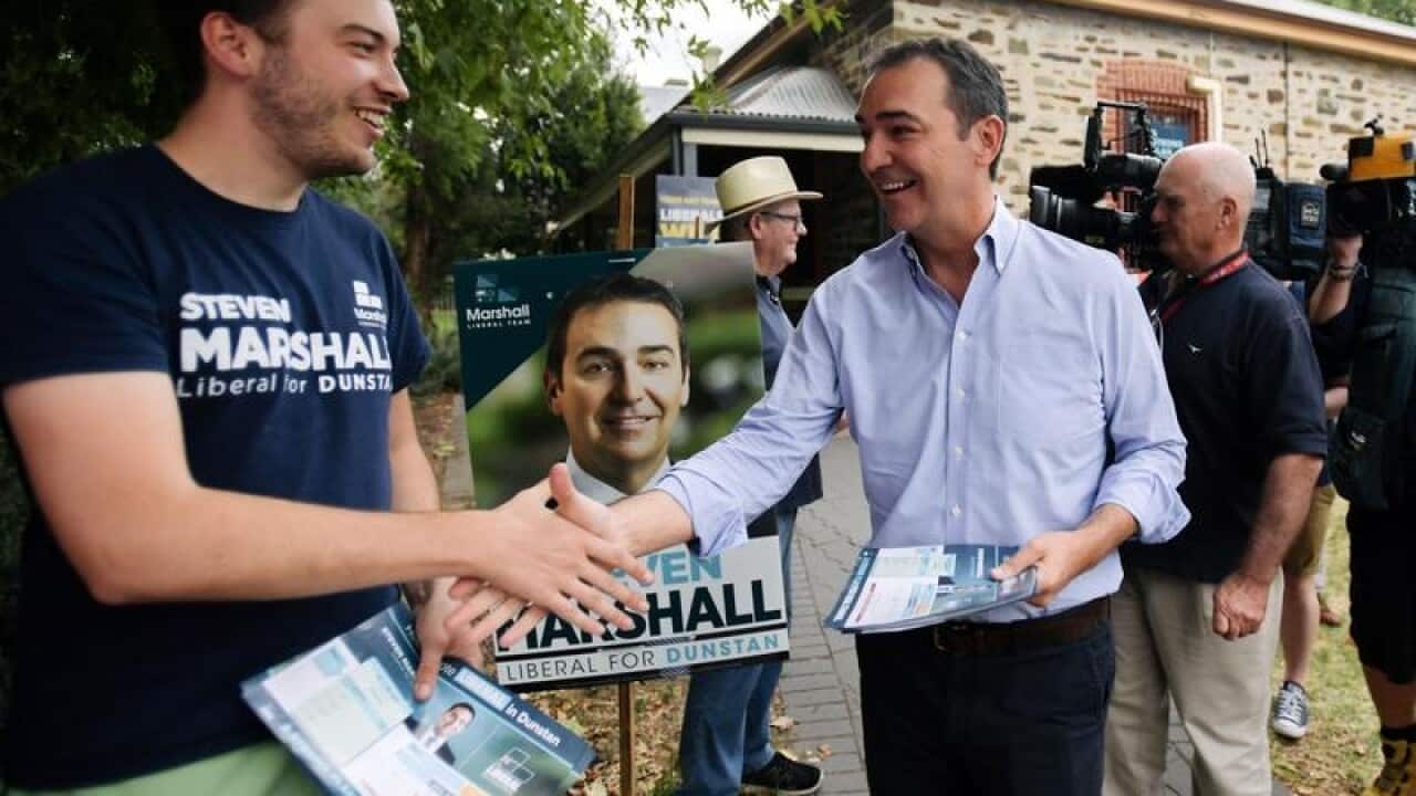 Steven Marshall campaigns at the polling station.