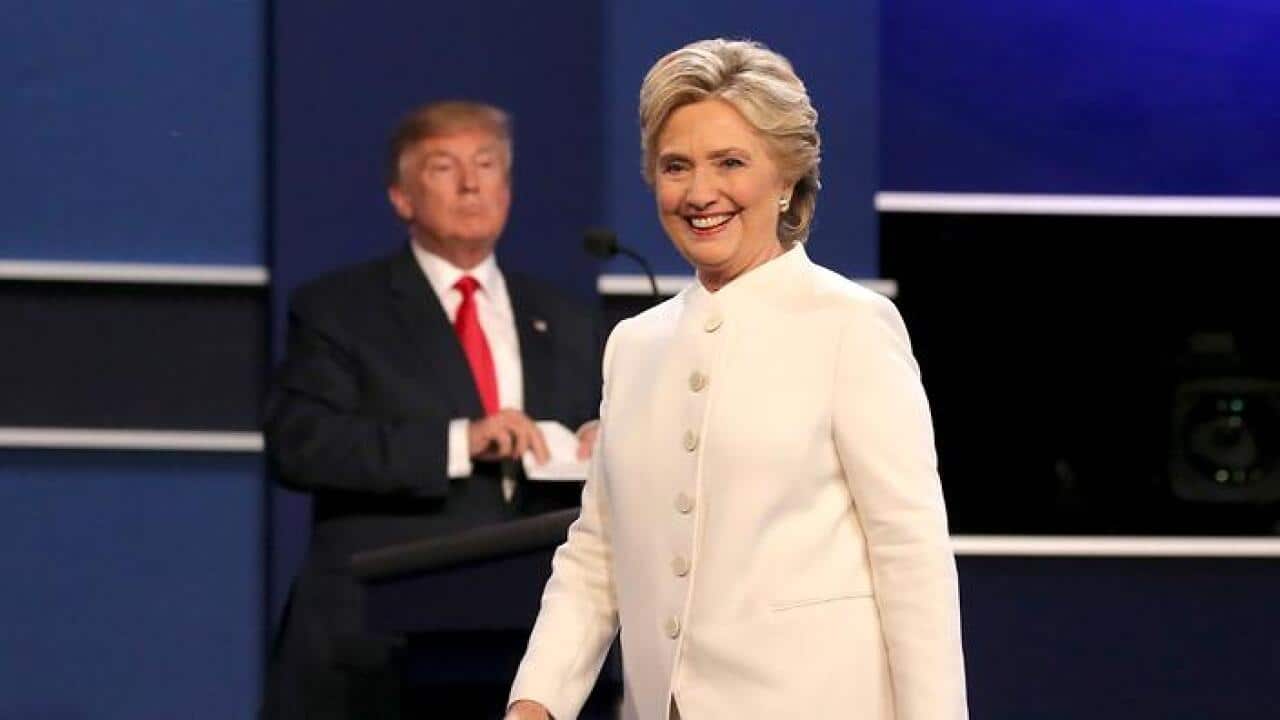 US Democratic candidate Hillary Clinton (R) and US Republican candidate Donald Trump (L) look on at the end of the final Presidential Debate on Oct 19
