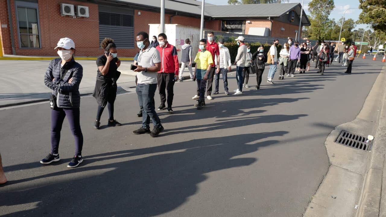 People waiting at the SW Sydney COVID vaccination centre at Macquarie Fields
