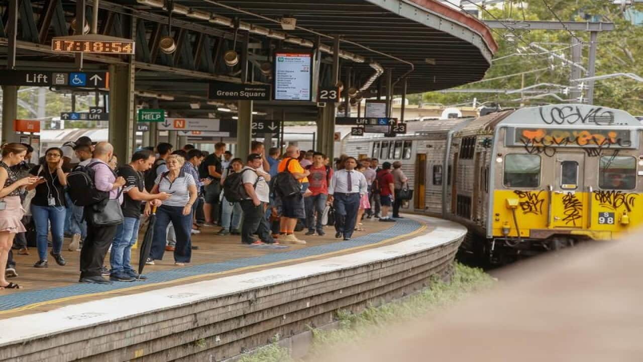 Commuters waiting for a train at Central Station Sydney.